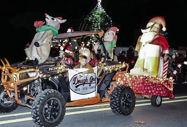 The Dough Joe rode down the parade route in their razor. BULLETIN PHOTOS/ Tracy Thayer