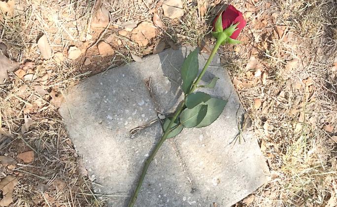 At the conclusion of a ceremony in recognition of Juneteenth last Monday, a rose was placed at every grave. Courtesy Photo