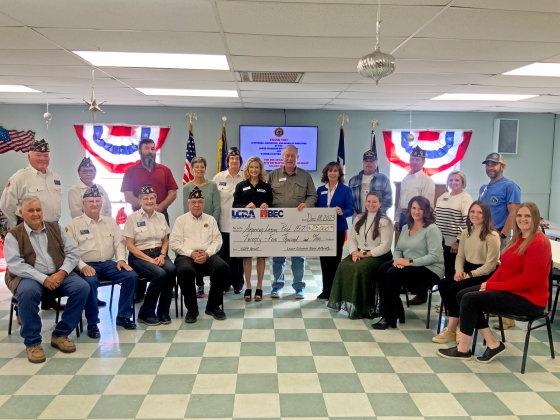 Seated from left: Richard Evans, Bandera County judge; Dennis Birchall, American Legion adjutant; Dr. Theresa Schulz and Roderick “Rod” Goff, American Legion members-at-large; Kati Fitzpatrick, BEC communications specialist; Charity Huber, BEC marketing and communications manager; Hannah Culak, BEC marketing design specialist; and Callie Cargile, BEC marketing specialist. Standing, from left to right, are: Rick Olivarez, American Legion 2nd vice president of programs; Marcie Perez, American Legion member-at