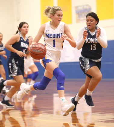 Lady Bobcat Cydney Newsom charges down the court during the basketball tournament held Medina ISD gymnasium. The Lady Bobcats placed fourth overall in the tournament. Courtesy Photo