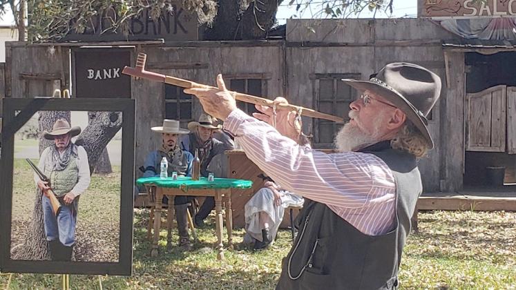 In honor of Tommy, Cattle Company Gunfighter Chuck Munson “Shorty” performed a short ceremony to demonstrate the proper use of the Chanupa. BULLETIN PHOTO/Cari Golyzniak