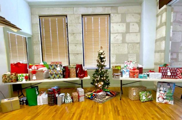Tables hold presents to be delivered to underprivileged families in Bandera County as part of the Angel Tree Project sponsored by the St. Vincentde Paul Society of St. Stanislaus’ Catholic Church. BULLETIN PHOTO/Tracy Thayer