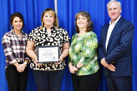 Board President Brittany Hicks with BISD Staff Member of the Month JoAnn Briones-Amador, Principal Dixie Moseley and Superintendent Gary Bitzkie.