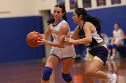 Brooke Mancha drives to the basket during the Lady Bobcats’ opening week to the season. Courtesy Photo 
