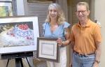 Doreen Shann poses with President Robert Behan after being named Artist of the Year for the Kerrville Art Club.