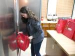 BEC Community Relations Associate Catie Rickert helps deliver turkeys to families in need. Courtesy Photo