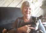 Pipe Creek resident Ann Edwards holds Cookie, a five-year-old chihuahua who disappeared following a fatal car accident only to be found and reunited with her family seven weeks later. On the left, Cookie’s twenty-year-old brother, Levi, hangs out on the
