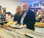 Denise Nordquist and Stevie Ray Anderson flip through records at the Sip and Shop in the Shops of Bandera on Friday night. (1) BULLETIN PHOTO/Tracy Thayer