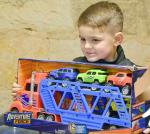 BULLETIN PHOTO/Tracy Thayer This young trucker in the making found his perfect toy at the Triple H Equiptherapy Holiday Party.